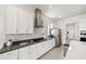 Bright kitchen with stainless steel appliances, white cabinets and countertops, and gas cooktop at 5081 Twin Lakes Blvd, St Cloud, FL 34772