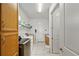 Functional laundry room with ample storage, including cabinets and shelving at 5081 Twin Lakes Blvd, St Cloud, FL 34772