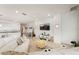 Open-concept living room with modern decor, tile flooring, and abundant natural light at 5081 Twin Lakes Blvd, St Cloud, FL 34772