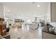 Spacious open-concept living area featuring a kitchen island, dining space, and cozy seating at 5081 Twin Lakes Blvd, St Cloud, FL 34772