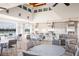 Community outdoor kitchen with multiple grills, cooking spaces, and seating, perfect for gatherings at 5081 Twin Lakes Blvd, St Cloud, FL 34772