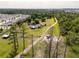 Expansive aerial view showcasing property, neighboring homes, and lush greenery at 5365 Rambling Rd, St Cloud, FL 34771