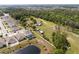 Sprawling property showing the house, sheds, and the surrounding neighborhood and woods at 5365 Rambling Rd, St Cloud, FL 34771