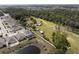 Sprawling property showing the house, sheds, and the surrounding neighborhood and woods at 5365 Rambling Rd, St Cloud, FL 34771