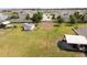Expansive backyard with shed, lean-to, boat, and tractor in a residential neighborhood at 5365 Rambling Rd, St Cloud, FL 34771