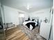 Bright bedroom with a ceiling fan, plush rug, and stylish white furniture at 5365 Rambling Rd, St Cloud, FL 34771