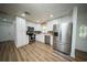 Modern kitchen with stainless steel appliances, white cabinetry, and stylish backsplash, creating a chef's dream space at 5365 Rambling Rd, St Cloud, FL 34771