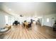 Spacious open-concept with stainless steel appliances, bright lighting, a dining area, and a home office space at 5365 Rambling Rd, St Cloud, FL 34771