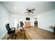 Spacious home office with modern desk, a ceiling fan, and lots of natural light at 5365 Rambling Rd, St Cloud, FL 34771