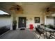 Covered porch with ceiling fans and outdoor dining area at 5365 Rambling Rd, St Cloud, FL 34771