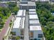 An aerial shot of modern townhomes with flat roofs, balconies, and window accents from an elevated perspective at 56 W Harding St, Orlando, FL 32806