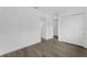 Bright, empty bedroom features modern gray floors, white walls, and closet with plenty of space at 56 W Harding St, Orlando, FL 32806