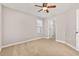 Bedroom featuring ceiling fan and ensuite bathroom entrance at 5911 Grassy Point Rd, Winter Garden, FL 34787