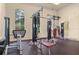 Well equipped fitness center with weight machines and bench seating at 5911 Grassy Point Rd, Winter Garden, FL 34787
