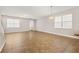 Open-concept living space with tile floors, abundant natural light, and versatile layout for comfortable living and entertaining at 5911 Grassy Point Rd, Winter Garden, FL 34787