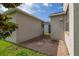 Cozy side patio with brick pavers and access to the backyard at 5911 Grassy Point Rd, Winter Garden, FL 34787