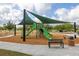 Community playground shaded with sun sails features a slide, climbing structure, and swings at 5911 Grassy Point Rd, Winter Garden, FL 34787