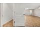 Under-stair storage area with tile flooring and bright, white door at 5911 Grassy Point Rd, Winter Garden, FL 34787