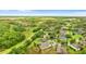 A beautiful aerial view of the home showcases its proximity to the surrounding neighborhood and natural areas at 6234 Tremayne Dr, Mount Dora, FL 32757