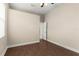 This bedroom features wood-look tile, and a door leading to another room or closet at 6234 Tremayne Dr, Mount Dora, FL 32757