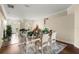 Elegant dining area showcasing a decorative table setting, adjacent to the foyer and hardwood flooring at 6234 Tremayne Dr, Mount Dora, FL 32757