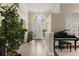 Bright foyer with tiled floors, high ceilings, and a decorative front door, creating a welcoming entrance at 6234 Tremayne Dr, Mount Dora, FL 32757