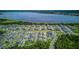 Expansive aerial view of a community near a beautiful lake at 625 Dogfish Ln, Debary, FL 32713
