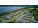 Overhead view of the neighborhood displaying rooftops and nearby lake at 625 Dogfish Ln, Debary, FL 32713