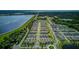 Wide aerial shot displays a community near a beautiful lake at 625 Dogfish Ln, Debary, FL 32713