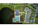 Beautiful aerial view of a community pool, playground, and lake perfect for outdoor recreation and relaxation at 625 Dogfish Ln, Debary, FL 32713