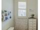 Bathroom with a modern vanity, decorative mirror, and stylish floral accents at 625 Dogfish Ln, Debary, FL 32713