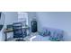 Cozy bedroom featuring a desk and shelving; offering a comfortable space for relaxation and work at 625 Dogfish Ln, Debary, FL 32713