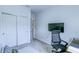 Comfortable bedroom offering a wardrobe, desk, and TV for relaxation, creating a versatile living area at 625 Dogfish Ln, Debary, FL 32713