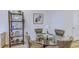 Comfortable dining area featuring a glass table, four chairs, and a display shelf at 625 Dogfish Ln, Debary, FL 32713