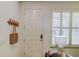 Bright entryway featuring a white door, shuttered window, and a convenient coat rack at 625 Dogfish Ln, Debary, FL 32713