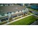 Charming townhome exterior featuring a covered front porch and verdant landscaping at 625 Dogfish Ln, Debary, FL 32713