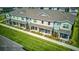 Townhome exterior with covered front porches and beautifully landscaped front yards at 625 Dogfish Ln, Debary, FL 32713