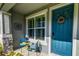 Inviting front porch featuring stylish seating, decorative accents, and a welcoming entrance at 625 Dogfish Ln, Debary, FL 32713