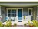 Inviting front porch featuring stylish seating, decorative accents, and a welcoming entrance at 625 Dogfish Ln, Debary, FL 32713