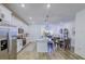 Modern kitchen featuring stainless steel appliances, white cabinetry, and an open layout with dining area at 625 Dogfish Ln, Debary, FL 32713