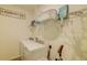 Well-organized laundry room includes a washer, dryer, storage shelves, laundry basket, and laundry supplies at 625 Dogfish Ln, Debary, FL 32713
