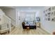 Inviting living room with modern furnishings, staircase, and wall decor creating a warm atmosphere at 625 Dogfish Ln, Debary, FL 32713
