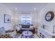 Bright living room with neutral tones, a comfortable sofa, and stylish decor at 625 Dogfish Ln, Debary, FL 32713