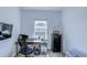 Well-lit home office features a desk, ergonomic chair, and storage, perfect for a productive workspace at 625 Dogfish Ln, Debary, FL 32713