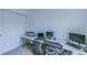 Bright office space featuring a built-in desk, neutral carpet, and a well-lit modern workspace at 625 Dogfish Ln, Debary, FL 32713