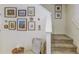 Entryway staircase with carpeted steps and decorative wall art at 625 Dogfish Ln, Debary, FL 32713