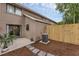 Cozy backyard patio with stone pavers, privacy fence, and space for outdoor seating at 752 Howland Ln # 114, Altamonte Springs, FL 32701