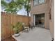 Private backyard patio with a wood fence, sliding glass door access, and mature trees at 752 Howland Ln # 114, Altamonte Springs, FL 32701