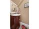 Cozy powder room featuring a wooden vanity cabinet and decorative accents at 752 Howland Ln # 114, Altamonte Springs, FL 32701