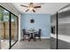 Cozy dining area with wood table set by bright window with a modern ceiling fan at 752 Howland Ln # 114, Altamonte Springs, FL 32701
